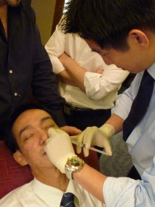 Patient getting Sculptra injected into his sunken tear trough by Dr Jonathan Lee